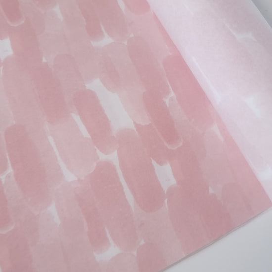 Video showing Watercolor paint strokes printed in pink ink on 30gsm white Tissue Paper